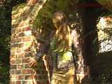 020067 Kathy Pees In The Window Alcove Of a Ruined Building 9
