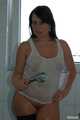 Benita taking a hot shower in a white undershirt and stockings 5