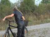 Watch Sandra riding her bike enjoying her shiny nylon Jumpsuit 10