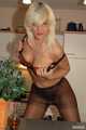 Natural busty Martina stripping on the kitchen counter 7