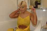 Busty Martina takes a hot bath in her yellow jumpsuit 6