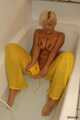 Busty Martina takes a hot bath in her yellow jumpsuit 8