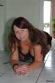 Chubby Benita posing in a black dress, stockings and heels 9