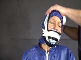 Watch Sandra beeing bound, pantygagged and finally pantyhooded in her shiny nylon Rainwear 10