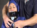 Watch Sandra beeing bound, pantygagged and finally pantyhooded in her shiny nylon Rainwear 7