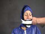 Watch Sandra beeing bound, pantygagged and finally pantyhooded in her shiny nylon Rainwear 9