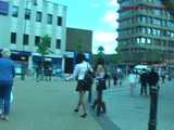 029013 Robyn Pees Behind A Parked Car In The Busy Shopping Street 5