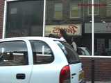 029013 Robyn Pees Behind A Parked Car In The Busy Shopping Street 6