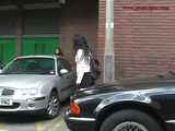 029013 Robyn Pees Behind A Parked Car In The Busy Shopping Street 7